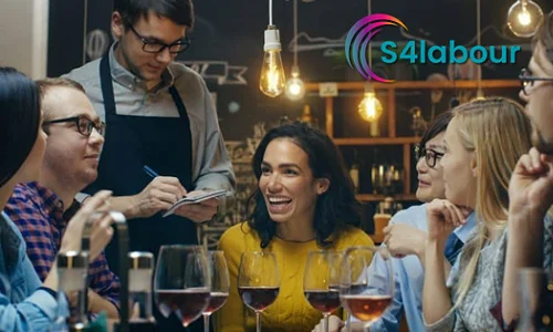 http://Friends%20around%20a%20table%20in%20a%20restaurant%20ordering%20from%20a%20waiter