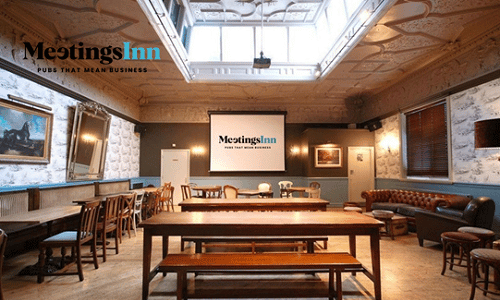 http://Room%20with%20table%20and%20chairs%20and%20a%20screen